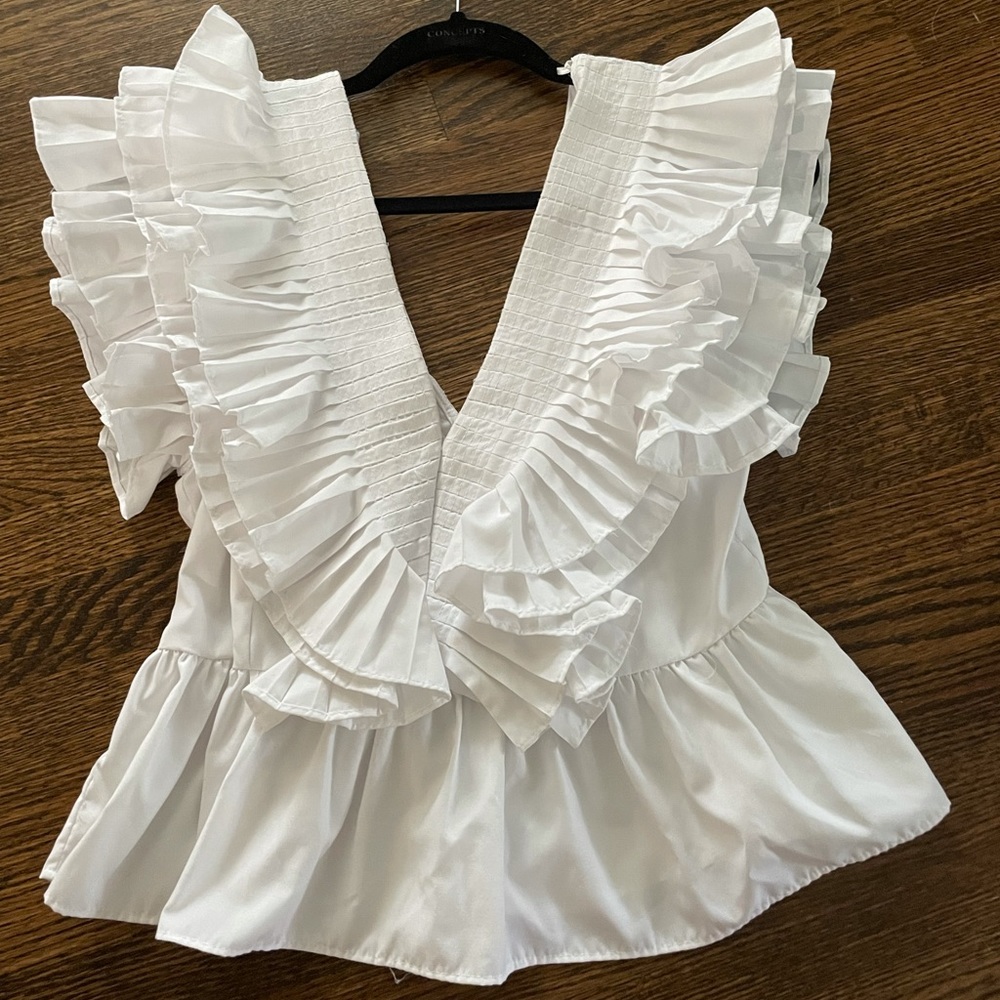 White frilly top